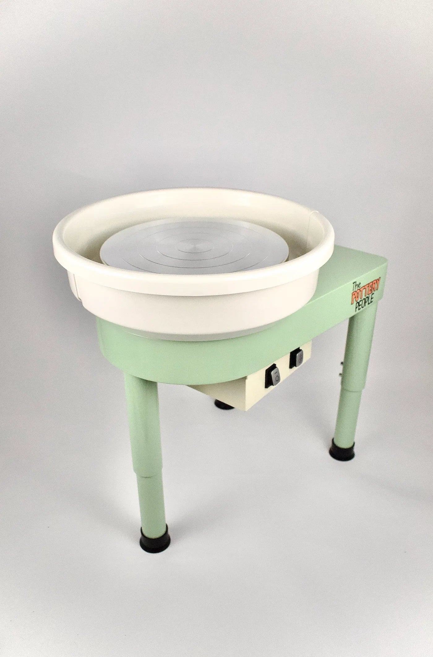 Home pottery wheel on a slight side angle iwth white background